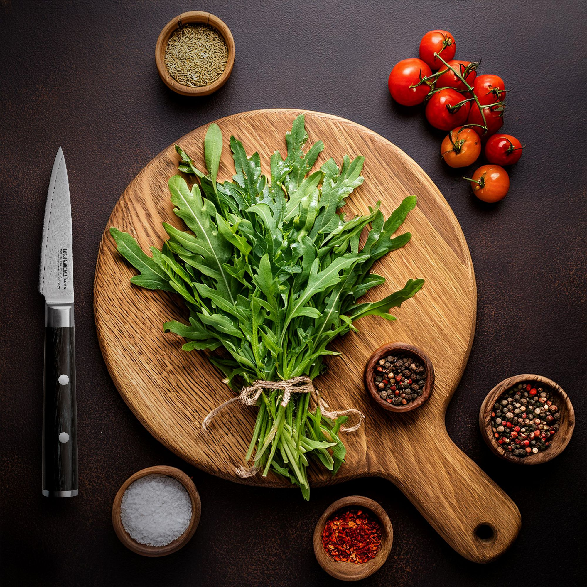 Bundle of fresh rocket on wooden board with spices and knife